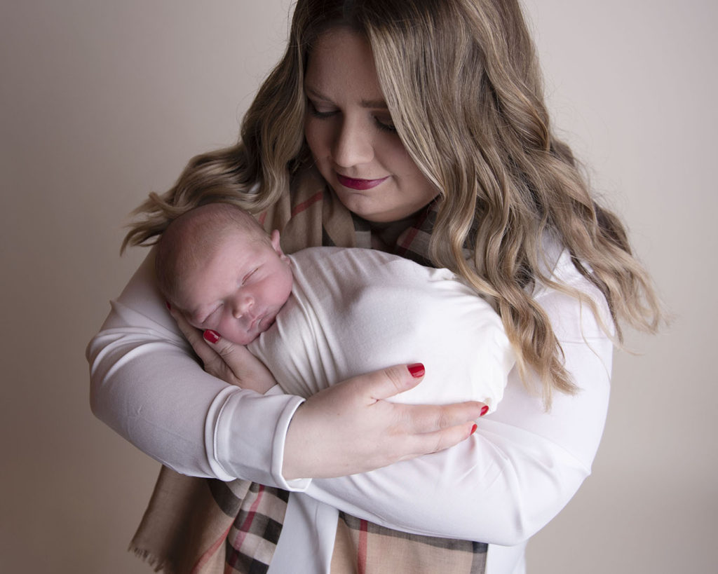 Baby boy with mom swaddle cradle newborn