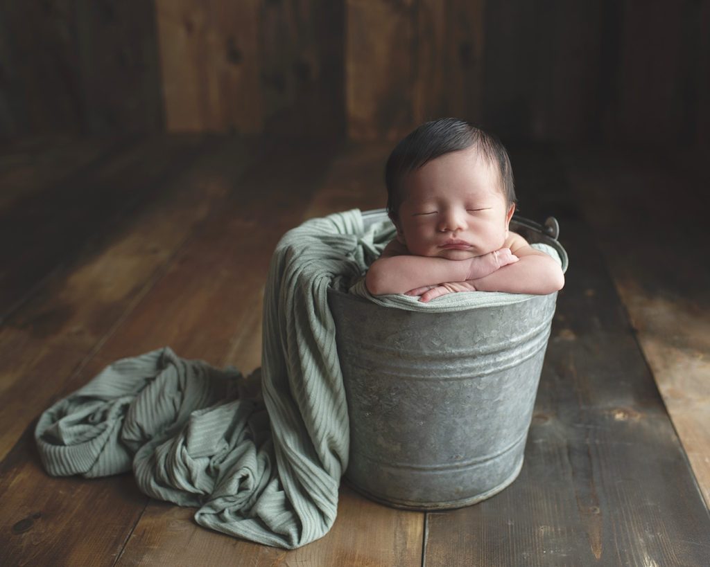 Hershey area newborn photographer lebanon county photography studio maternity newborn infant baby mint green baby boy in bucket prop