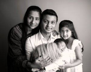 baby boy with family newborn photo