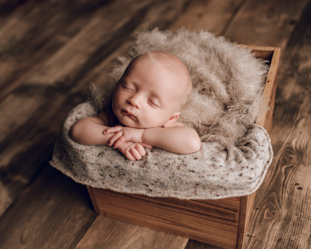 newborn in a wood crate newborn boy palmyra pa newborn photographer