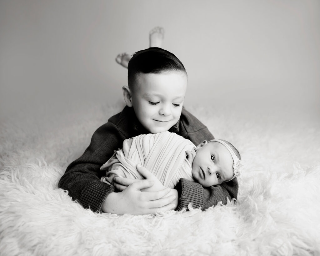newborn with brother black and white kcb photography llc 
